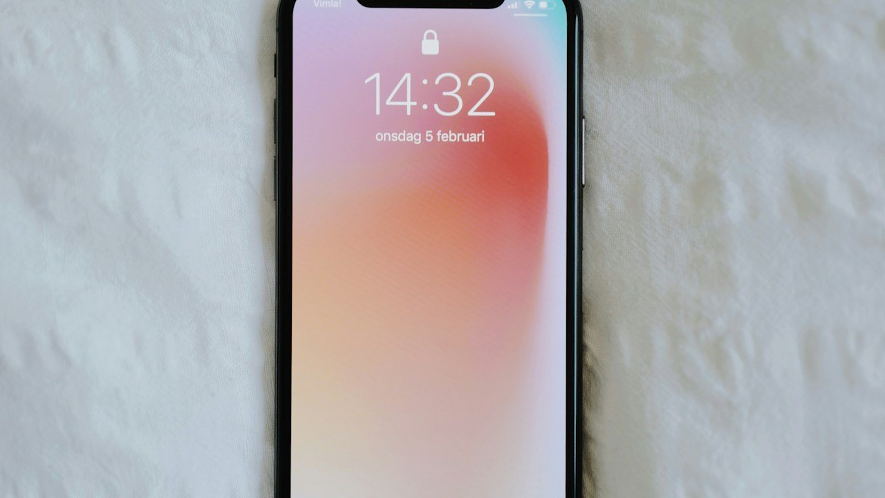 Professional technician replacing an iPhone screen at K2J Tech workbench