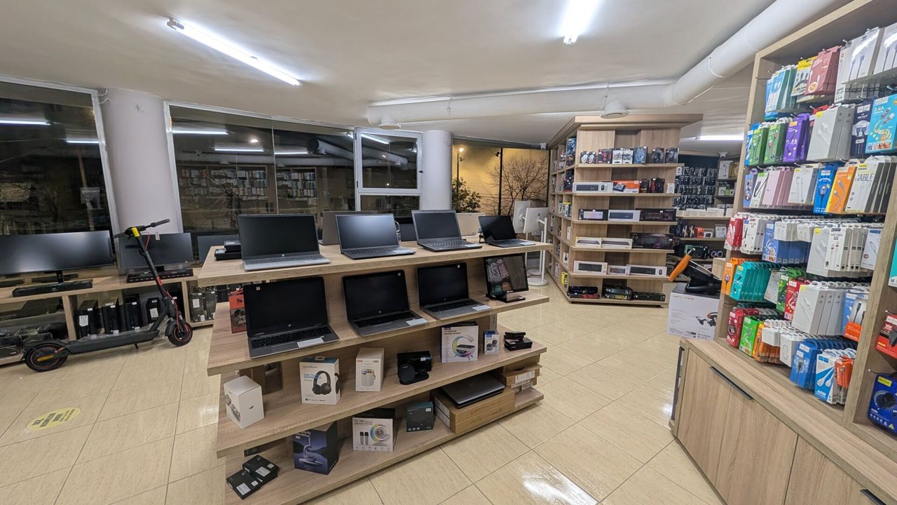 Inside the K2J Tech store in Sarandë, with laptops and devices on display